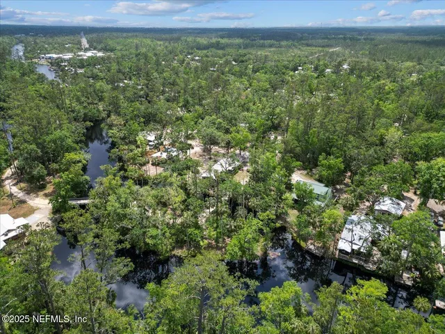 a view of a garden with a building in the background