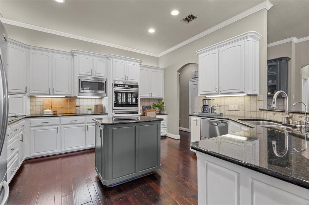 2030 Rustic Trail Waco, TX 76657 - Photo 11 of 40 a kitchen with stainless steel appliances granite countertop a sink stove and refrigerator