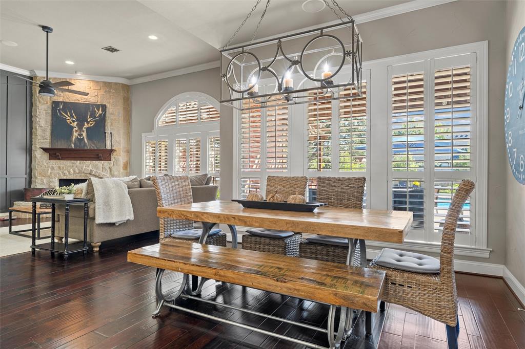 2030 Rustic Trail Waco, TX 76657 - Photo 12 of 40 a dining room with wooden floor and a chandelier