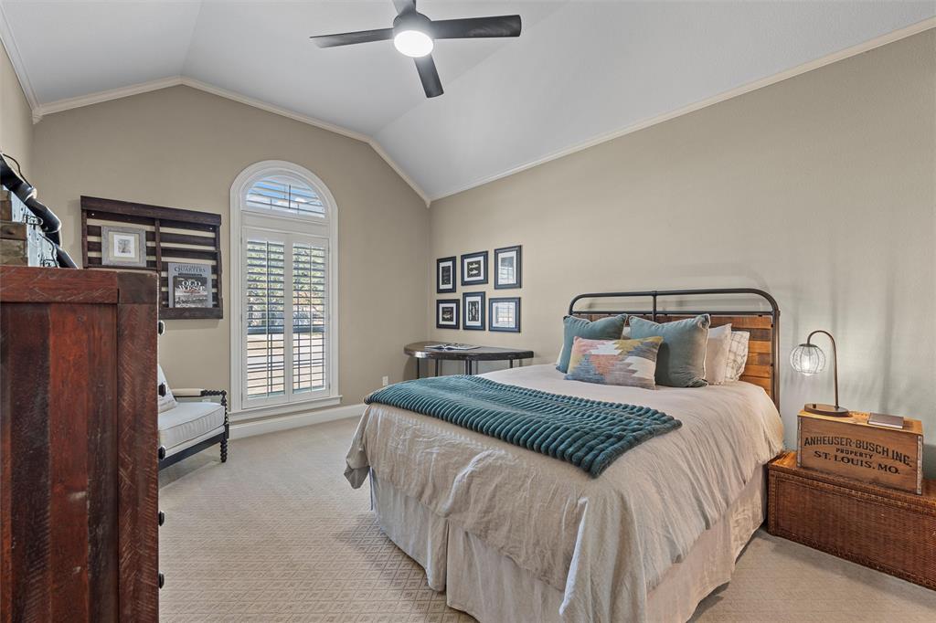 2030 Rustic Trail Waco, TX 76657 - Photo 17 of 40 a bedroom with a bed and a chandelier