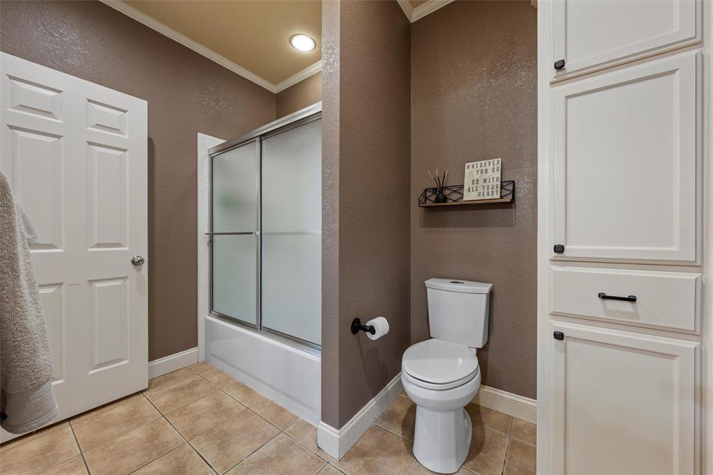 2030 Rustic Trail Waco, TX 76657 - Photo 19 of 40 a bathroom with a toilet a sink and shower