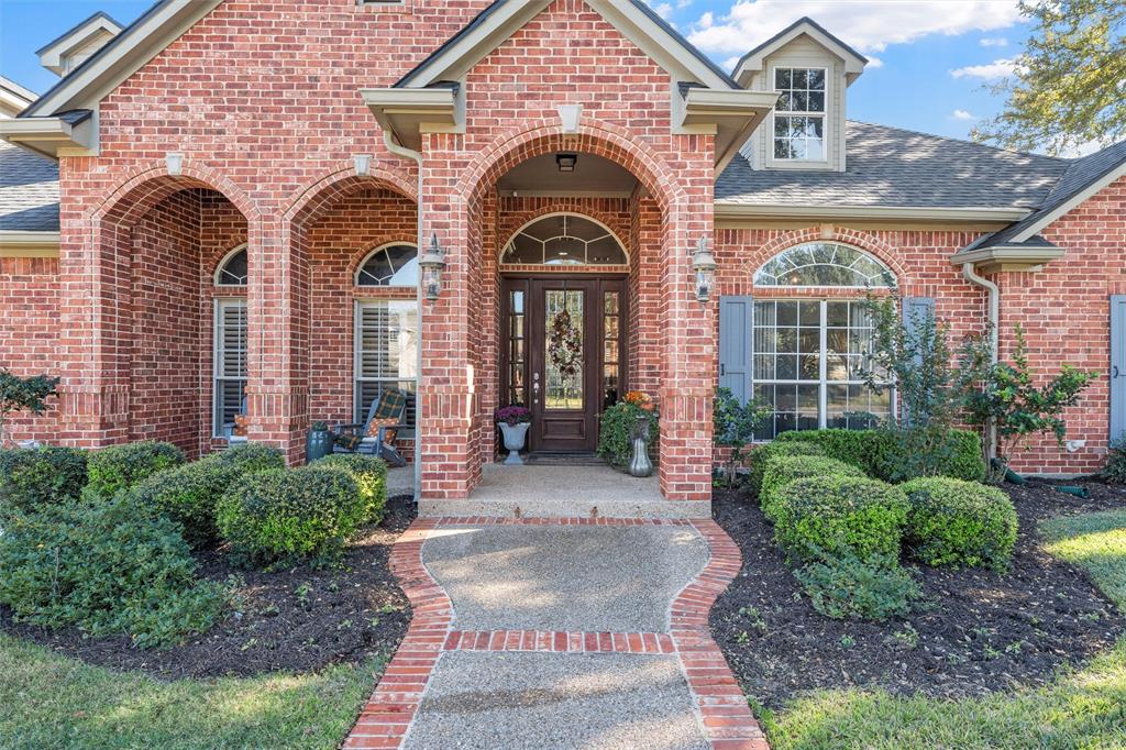 2030 Rustic Trail Waco, TX 76657 - Photo 2 of 40 a view of a brick house with large windows