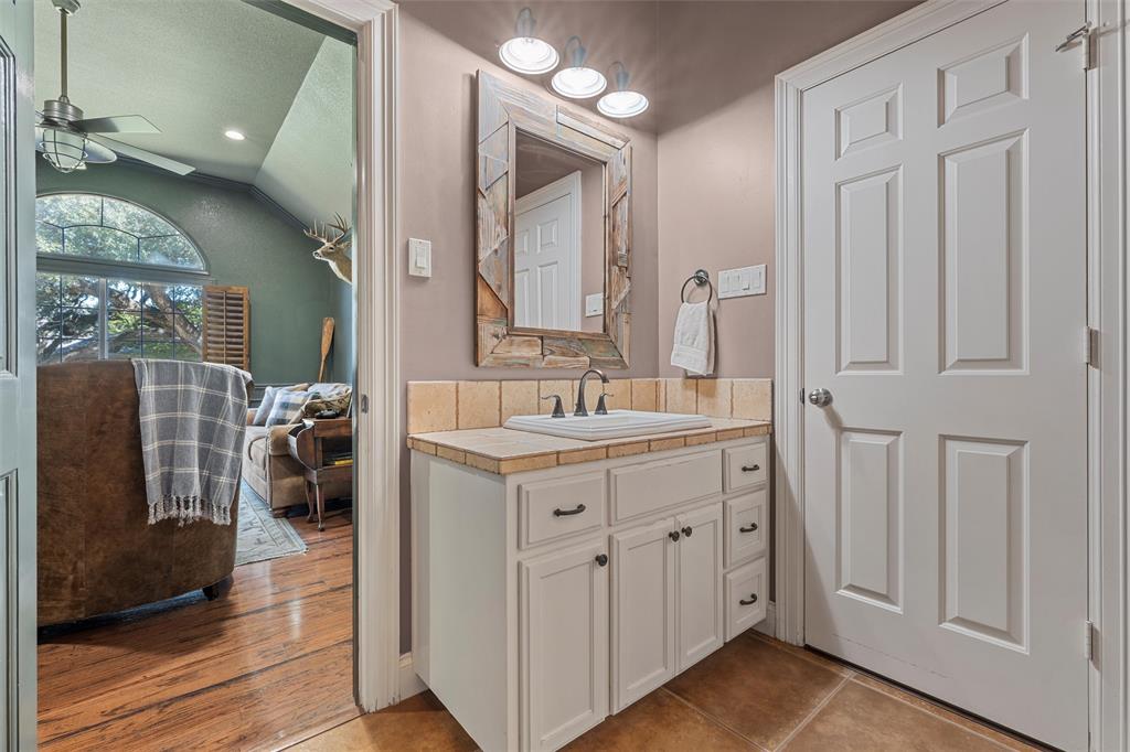 2030 Rustic Trail Waco, TX 76657 - Photo 24 of 40 a spacious bathroom with a double vanity sink and a mirror