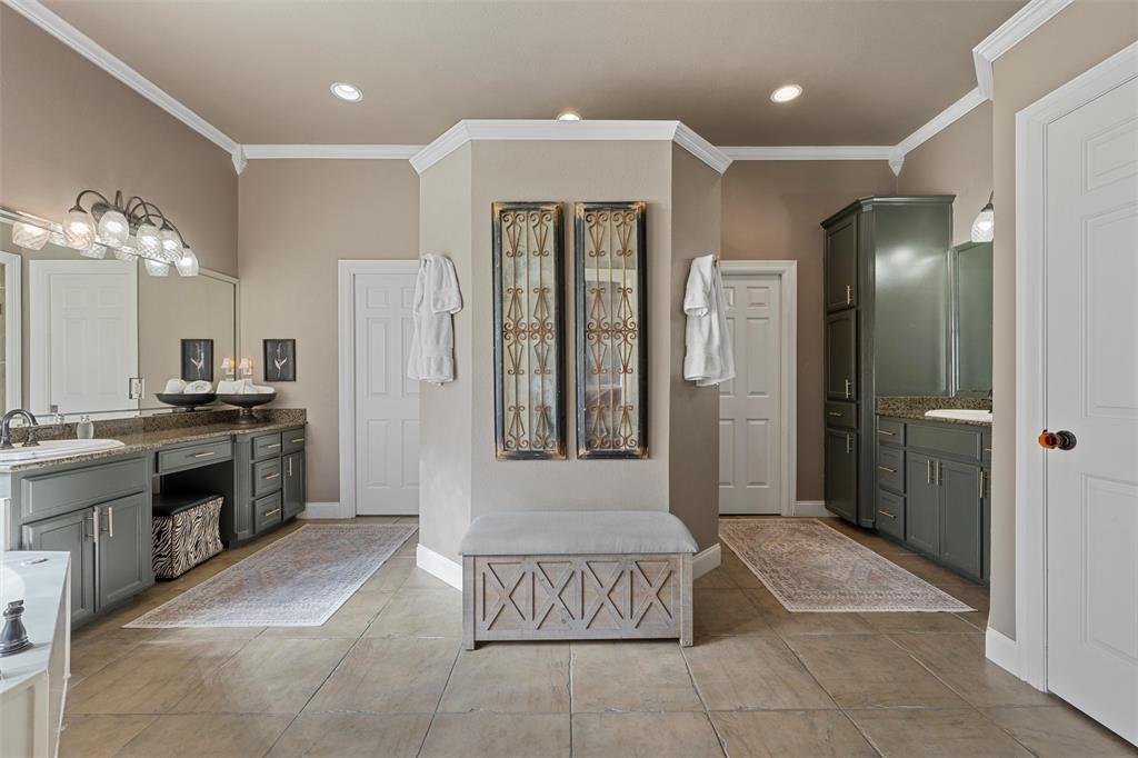 2030 Rustic Trail Waco, TX 76657 - Photo 31 of 40 a bathroom with a tub a sink a mirror and a shower