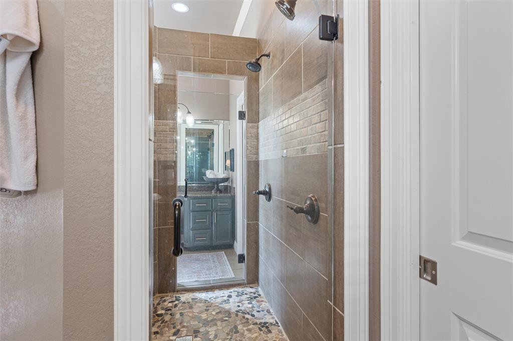 2030 Rustic Trail Waco, TX 76657 - Photo 33 of 40 a bathroom with a glass shower door