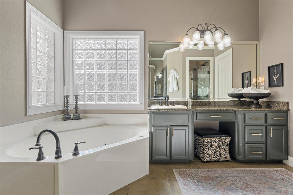 2030 Rustic Trail Waco, TX 76657 - Photo 34 of 40 a bathroom with a sink and a large mirror