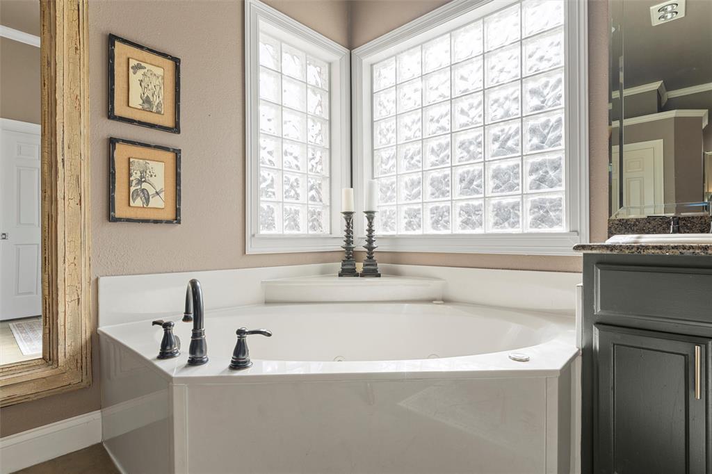 2030 Rustic Trail Waco, TX 76657 - Photo 35 of 40 a white bath tub sitting next to a window