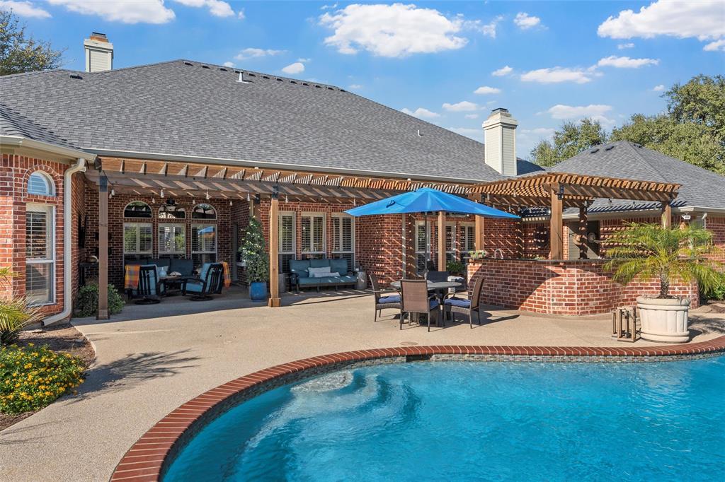 2030 Rustic Trail Waco, TX 76657 - Photo 38 of 40 a view of a house with floor to ceiling windows and a table