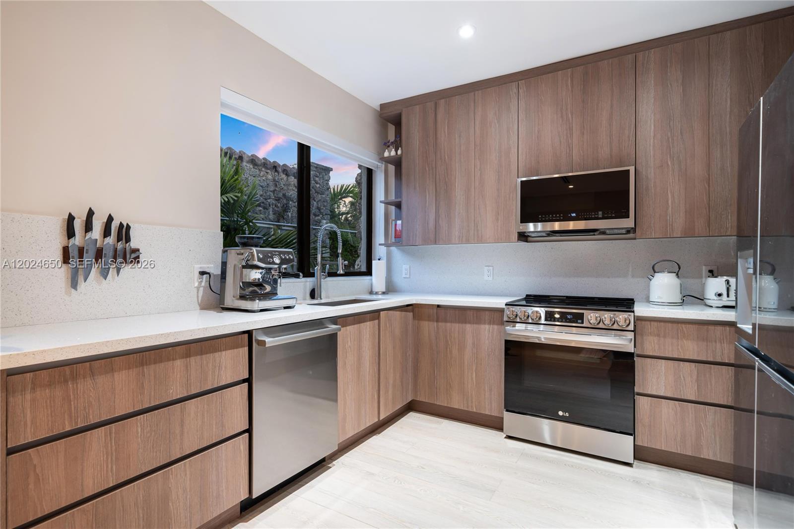 1663 Southwest 13th Street Miami, FL 33145 - Photo 67 of 112 a kitchen with a sink stove and microwave