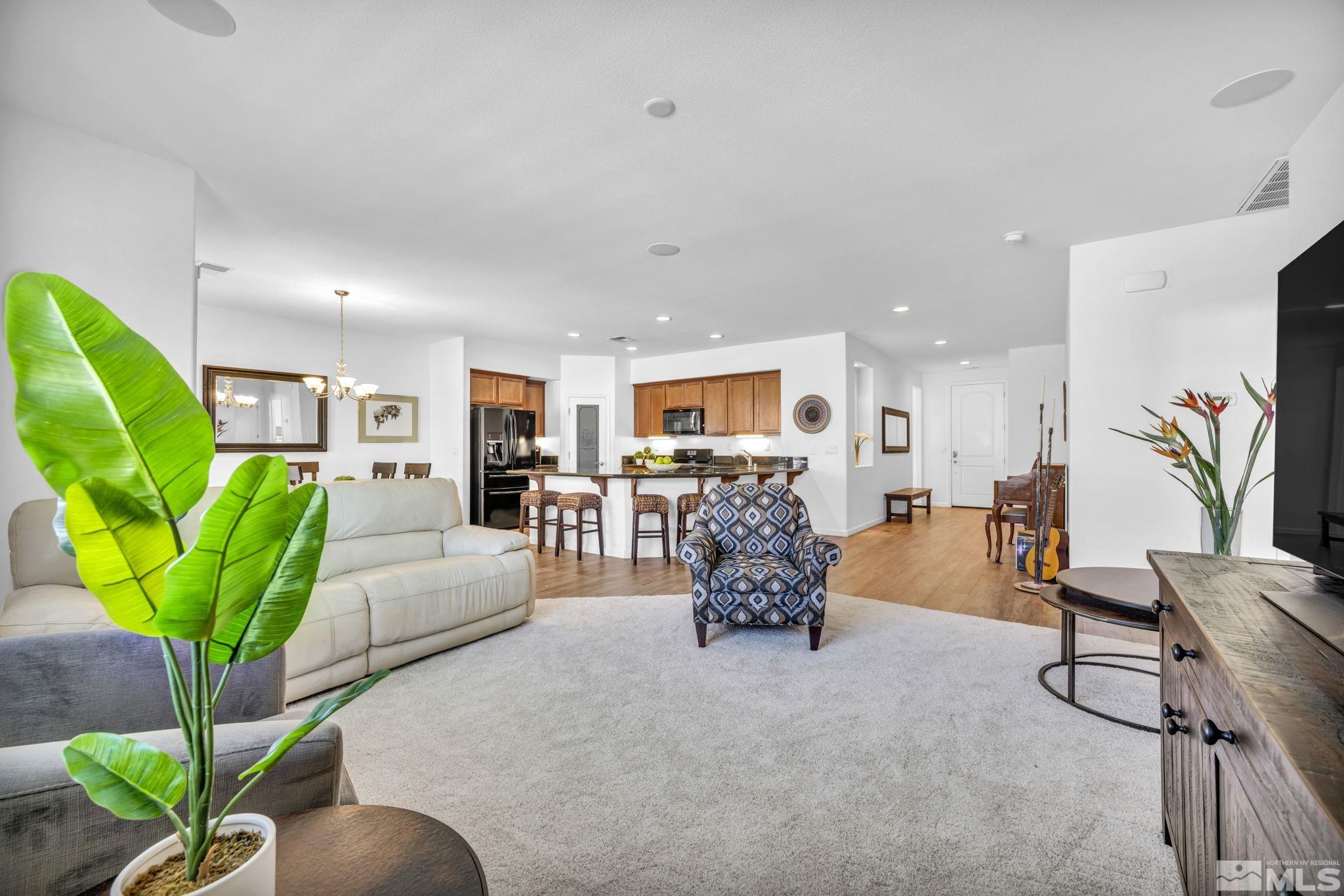2197 Berkich Court Reno, NV 89521 - Photo 13 of 40 a living room with furniture potted plant and a large window