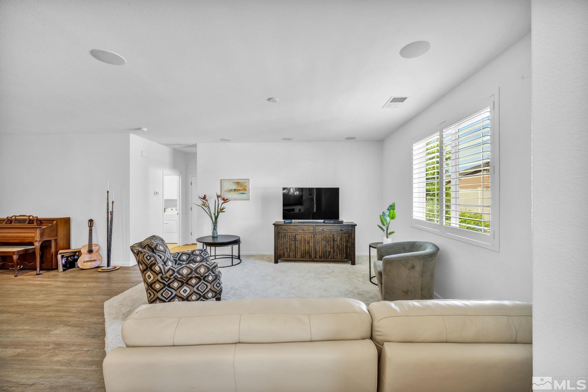 2197 Berkich Court Reno, NV 89521 - Photo 14 of 40 a living room with furniture and a flat screen tv