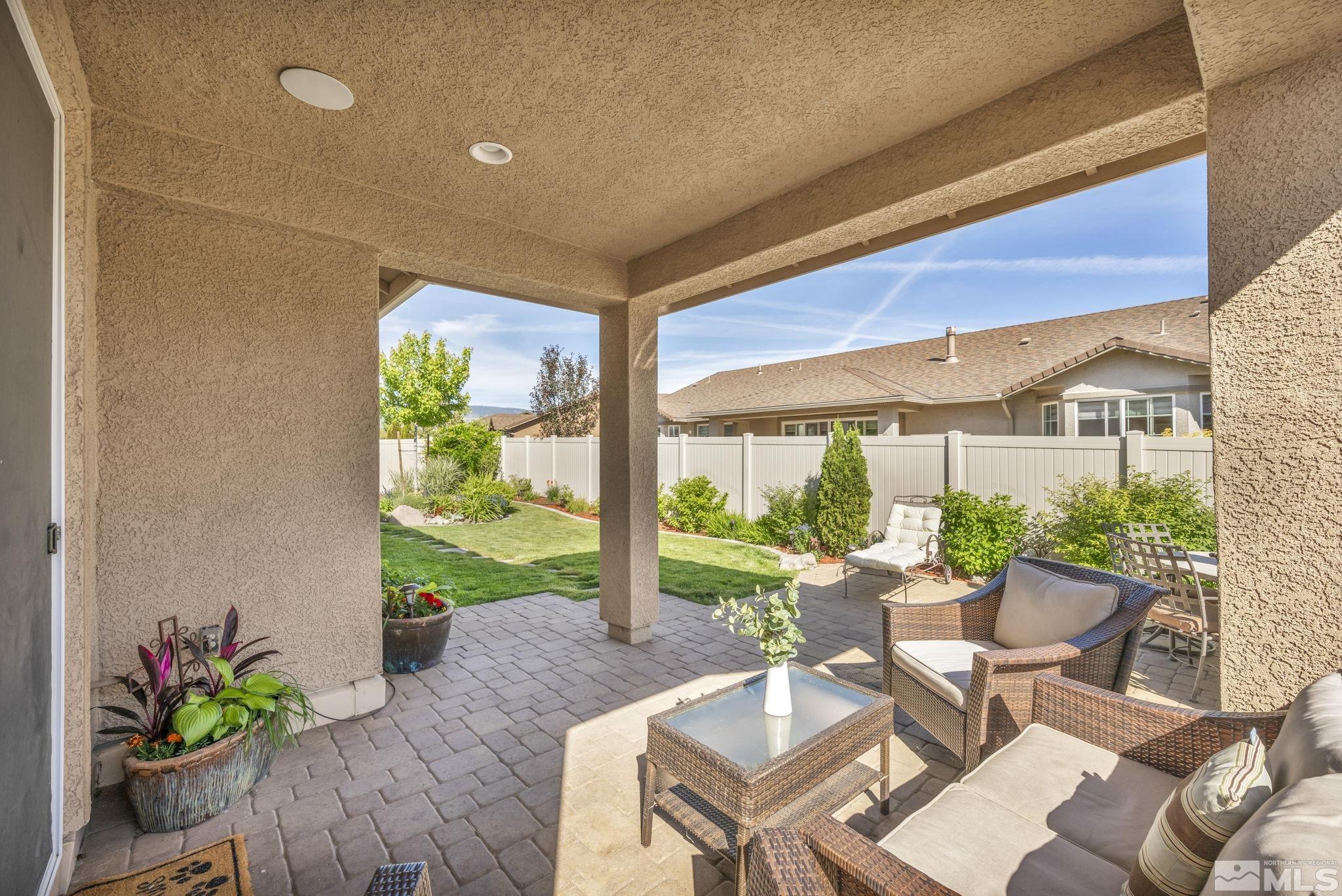 2197 Berkich Court Reno, NV 89521 - Photo 28 of 40 a view of an outdoor dining space with a table and chairs