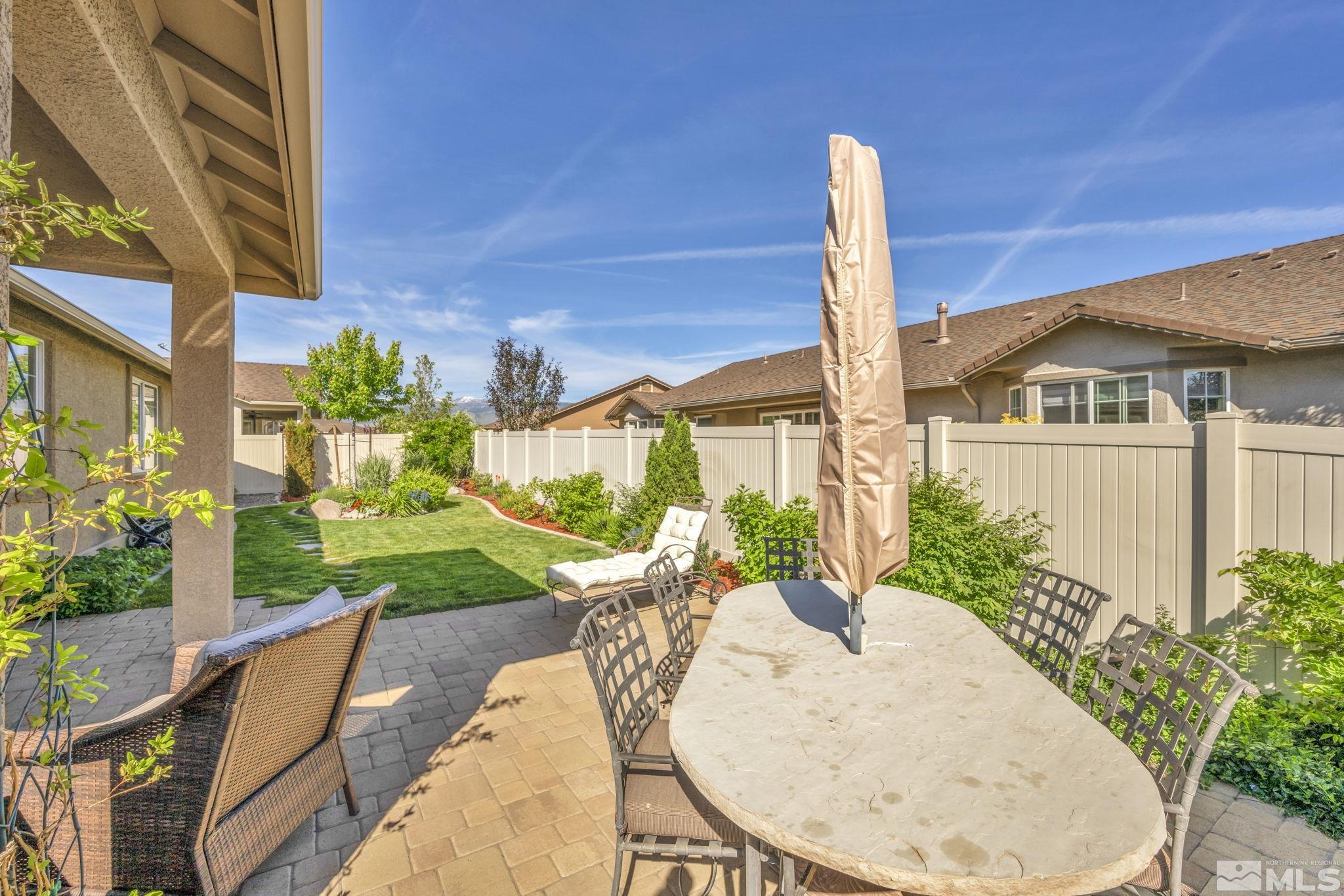 2197 Berkich Court Reno, NV 89521 - Photo 31 of 40 a view of a patio with table and chairs and plants