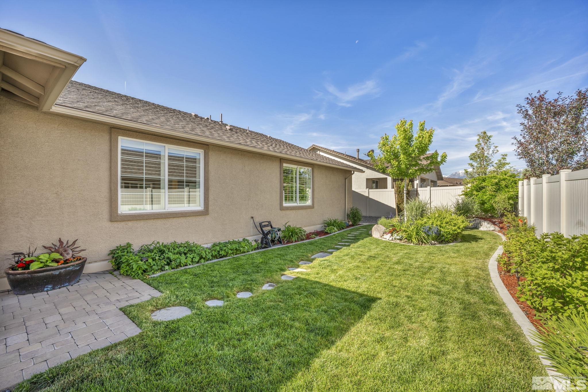 2197 Berkich Court Reno, NV 89521 - Photo 32 of 40 a front view of a house with garden