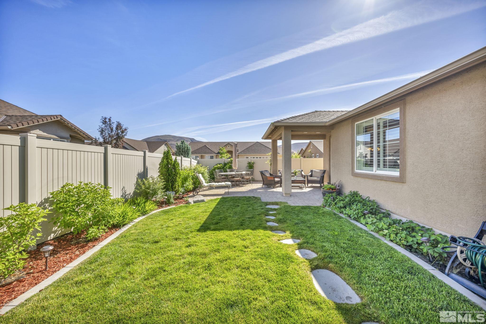 2197 Berkich Court Reno, NV 89521 - Photo 37 of 40 a view of a backyard with plants and a patio