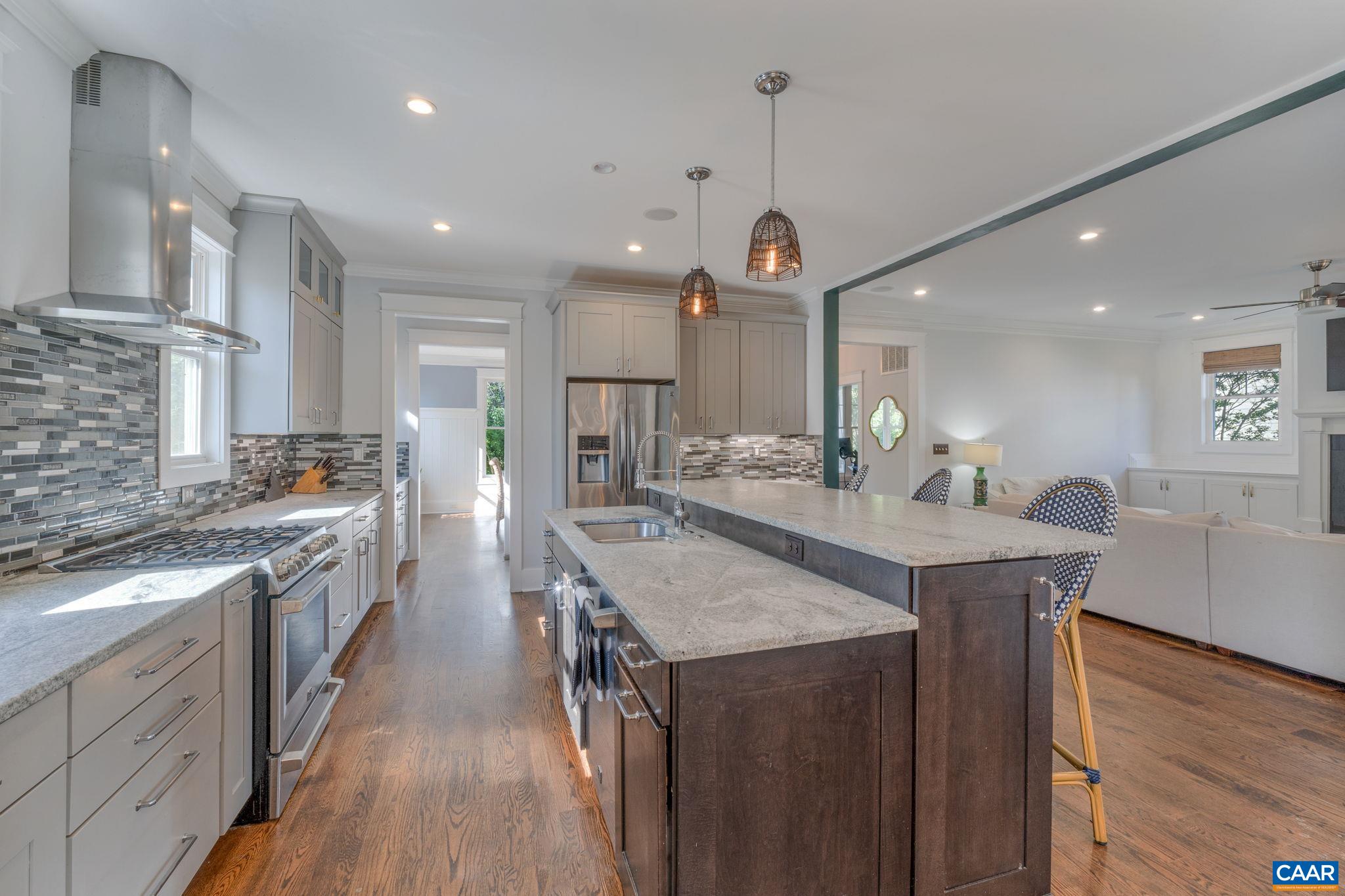 5123 Brook View Road Crozet, VA 22932 - Photo 17 of 75 a large kitchen with a large island in the center a sink stainless steel appliances and cabinets