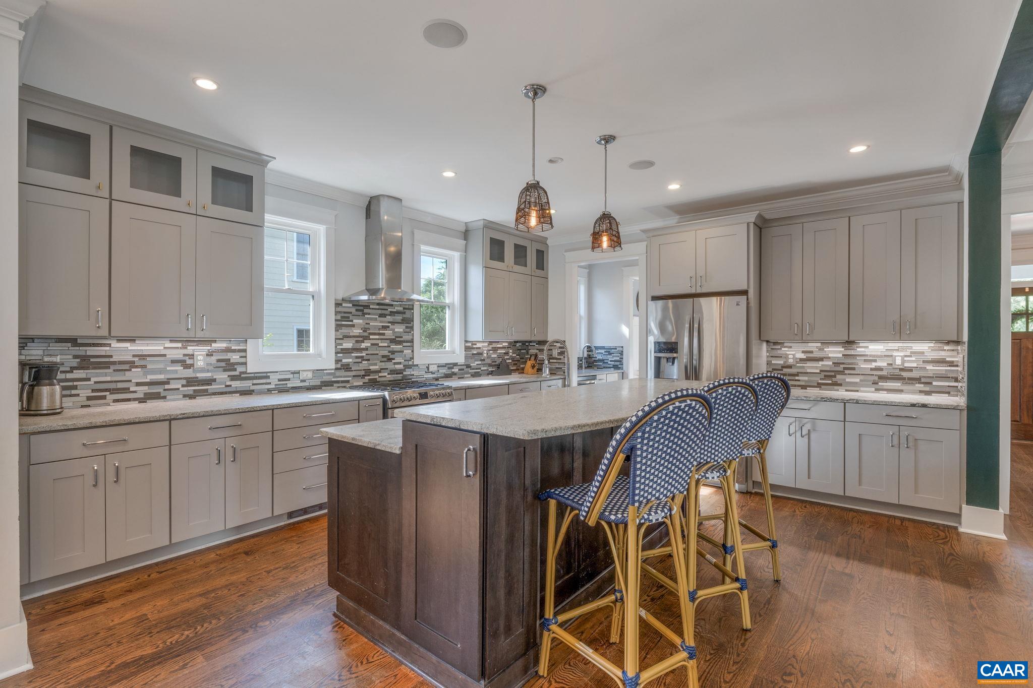 5123 Brook View Road Crozet, VA 22932 - Photo 19 of 75 a kitchen with stainless steel appliances kitchen island granite countertop a stove a sink and a refrigerator