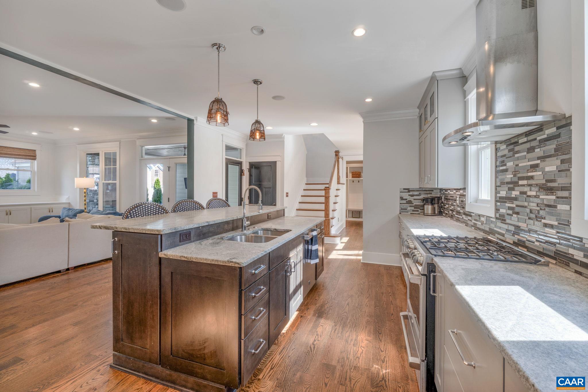 5123 Brook View Road Crozet, VA 22932 - Photo 20 of 75 a kitchen with stainless steel appliances granite countertop a sink a stove and a wooden floors