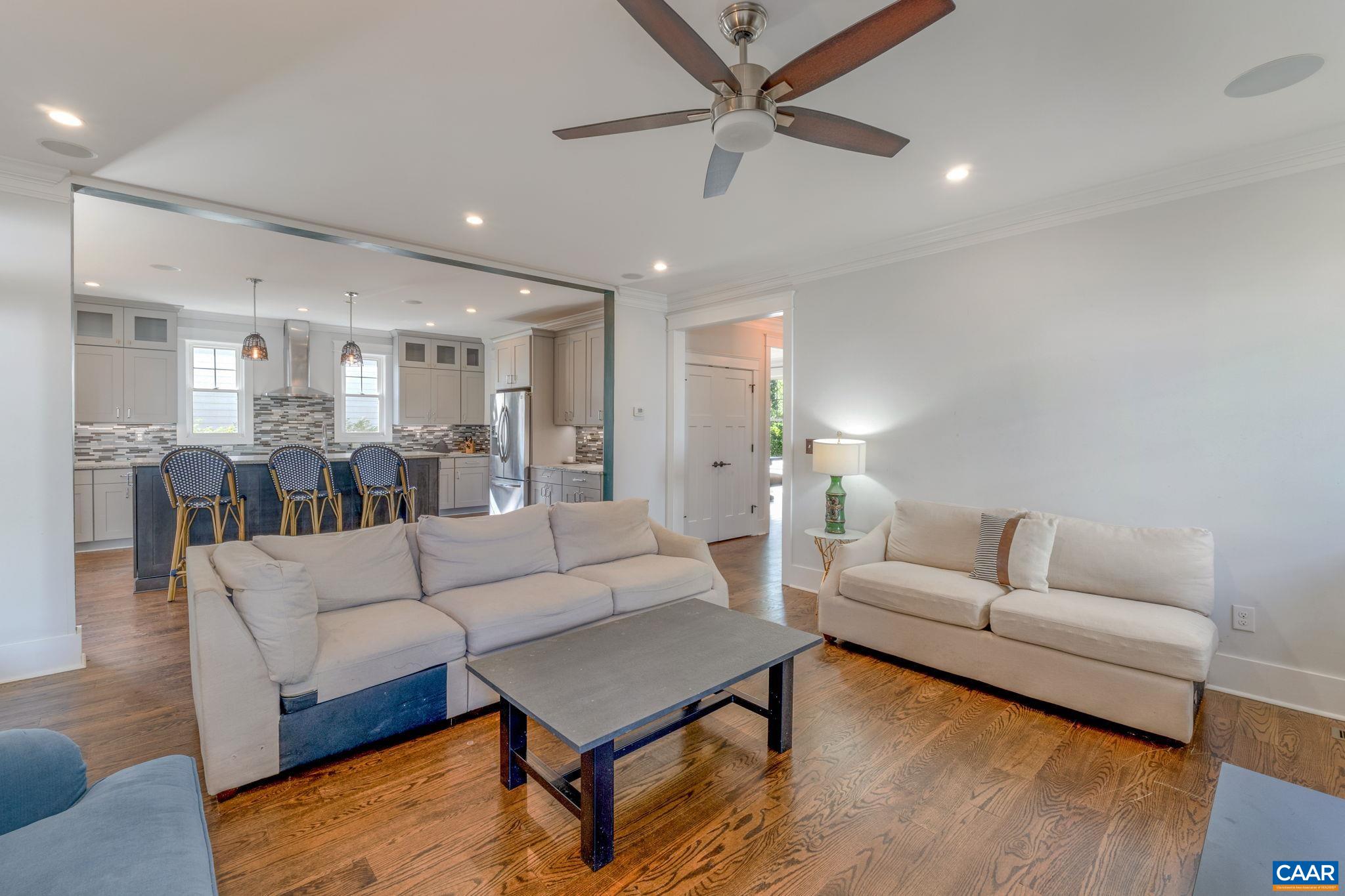 5123 Brook View Road Crozet, VA 22932 - Photo 24 of 75 a living room with furniture and a chandelier
