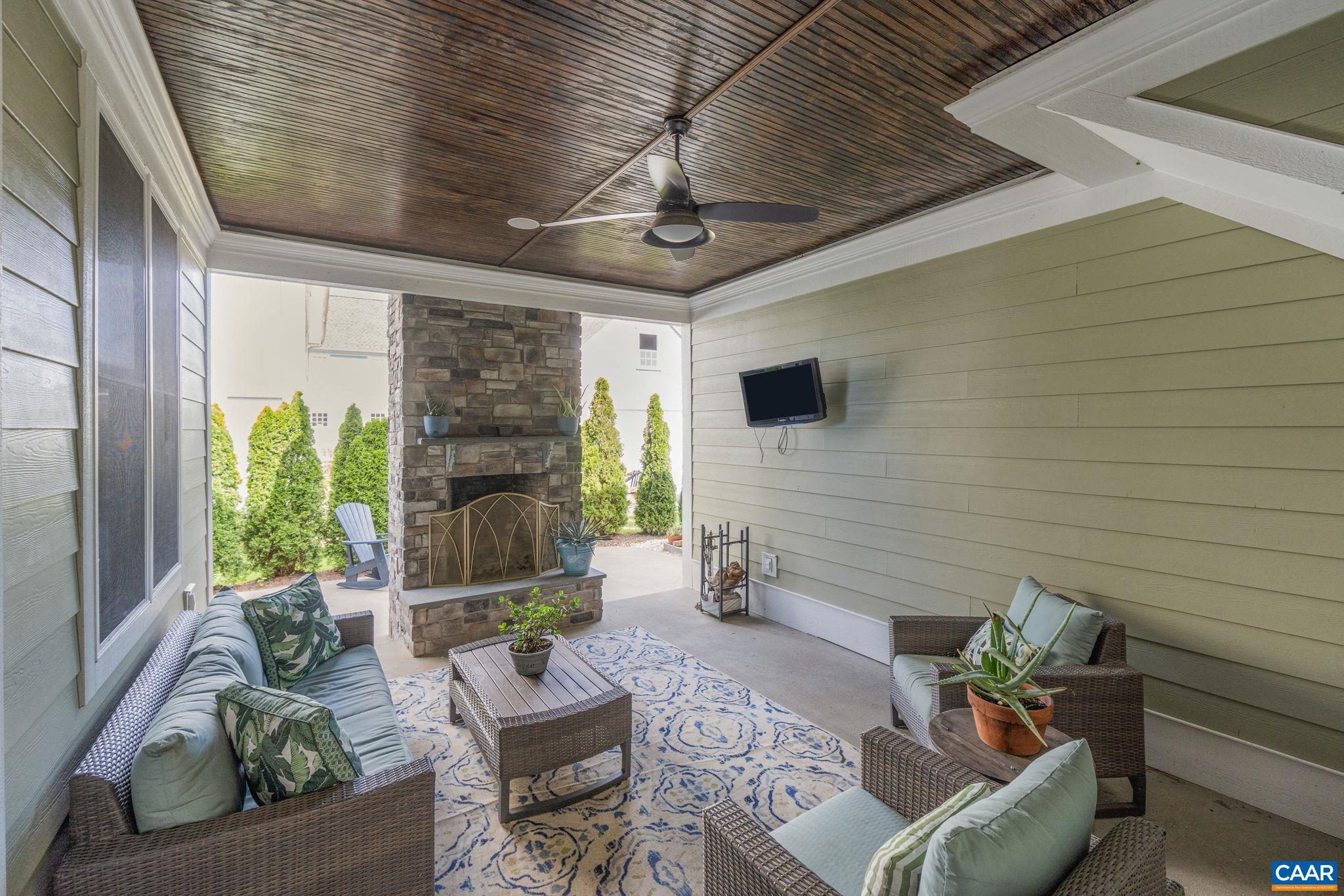 5123 Brook View Road Crozet, VA 22932 - Photo 26 of 75 a outdoor living space with furniture potted plant and a large window