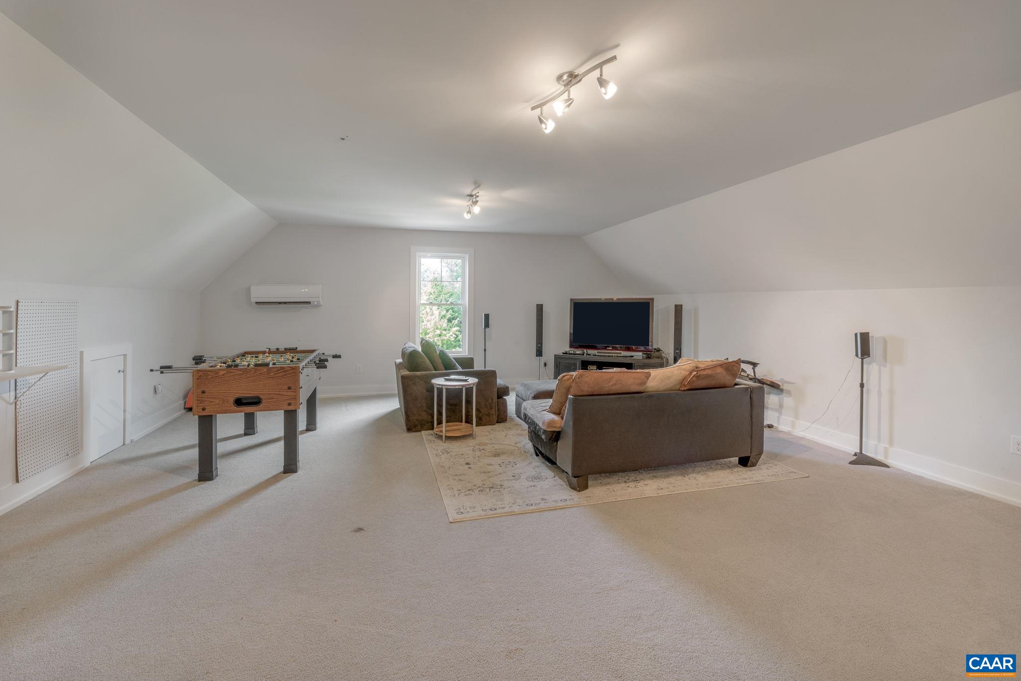 5123 Brook View Road Crozet, VA 22932 - Photo 55 of 75 a living room with furniture and a flat screen tv