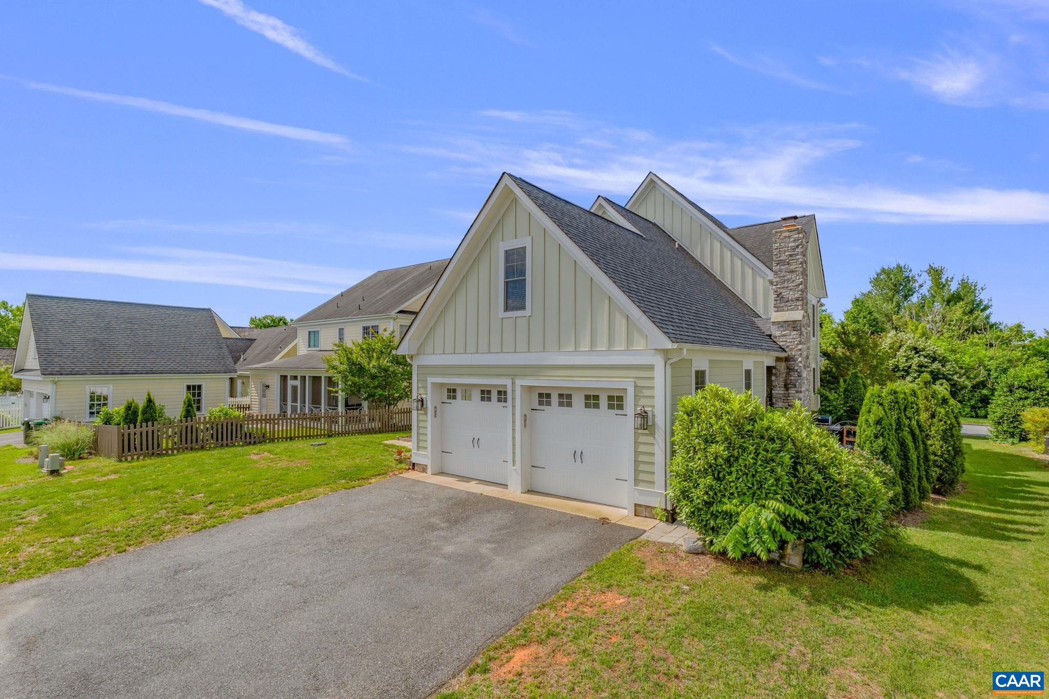 5123 Brook View Road Crozet, VA 22932 - Photo 59 of 75 a front view of a house with a yard and garage