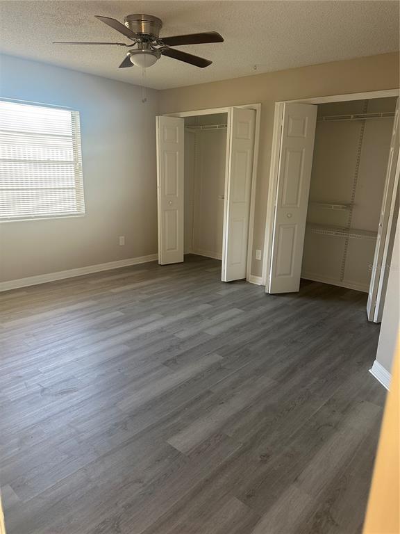 951 Bryan Court Longwood, FL 32750 - Photo 5 of 6 an empty room with wooden floor closet and windows