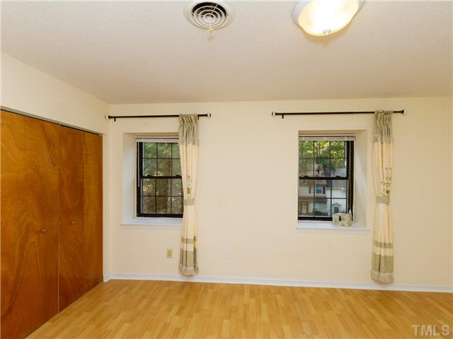 1330 Springlawn Court Raleigh, NC 27609 - Photo 12 of 19 a view of a room with wooden floor and window