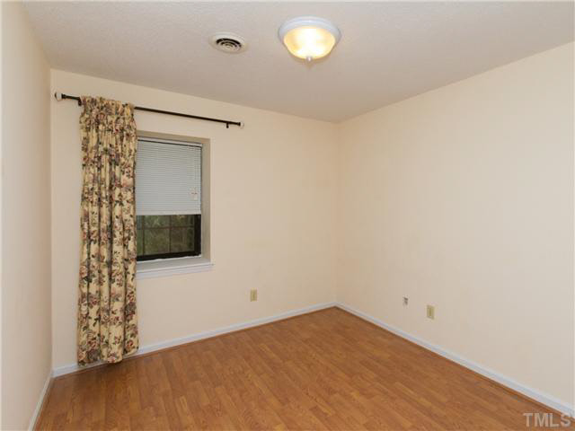 1330 Springlawn Court Raleigh, NC 27609 - Photo 15 of 19 a view of empty room with window