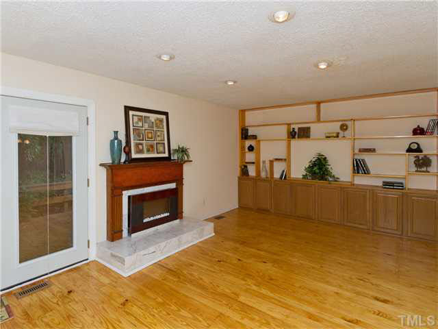 1330 Springlawn Court Raleigh, NC 27609 - Photo 3 of 19 a view of a livingroom with a fireplace