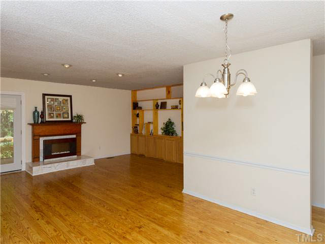 1330 Springlawn Court Raleigh, NC 27609 - Photo 8 of 19 a view of a livingroom with a chandelier