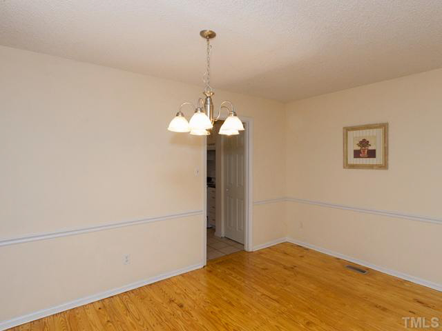 1330 Springlawn Court Raleigh, NC 27609 - Photo 9 of 19 a view of a room with a chandelier fan