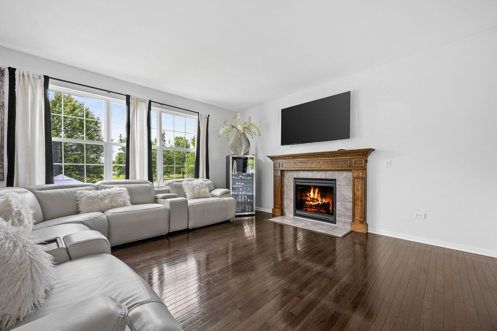 2297 Deerpath Road Bolingbrook, IL 60490 - Photo 10 of 46 a living room with furniture and a fireplace