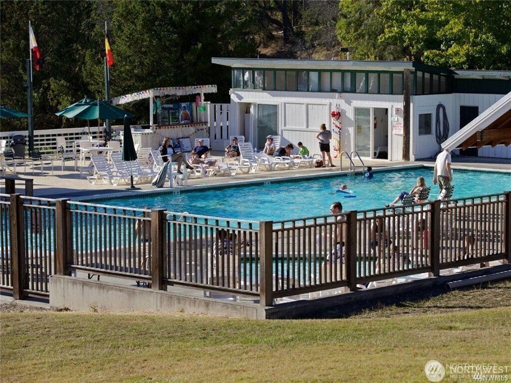 98 Armadale Road, Unit 215 Friday Harbor, WA 98250 - Photo 36 of 39 a view of a house with a wooden deck and furniture