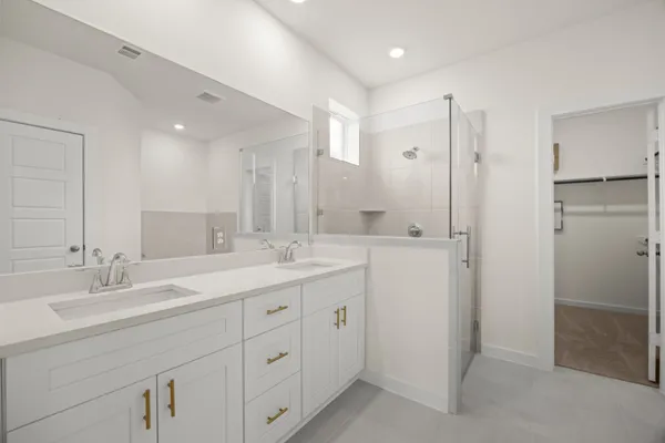 a bathroom with a double vanity sink mirror and double