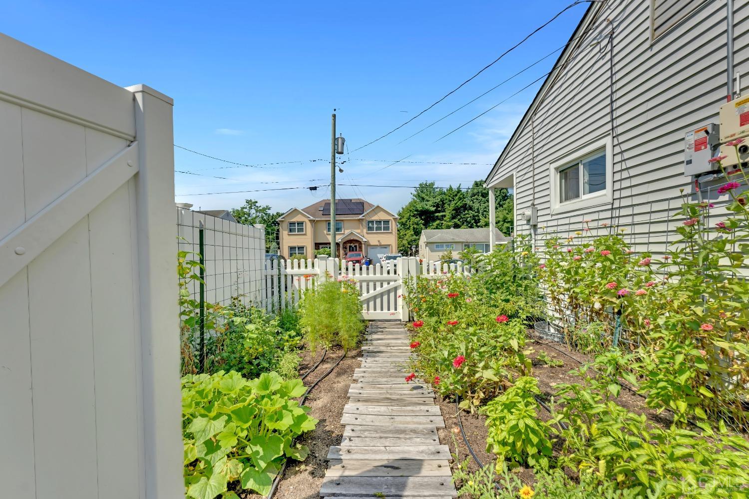 3237 Banta Road South Plainfield, NJ 07080 - Photo 26 of 26 a view of a house with a flower garden