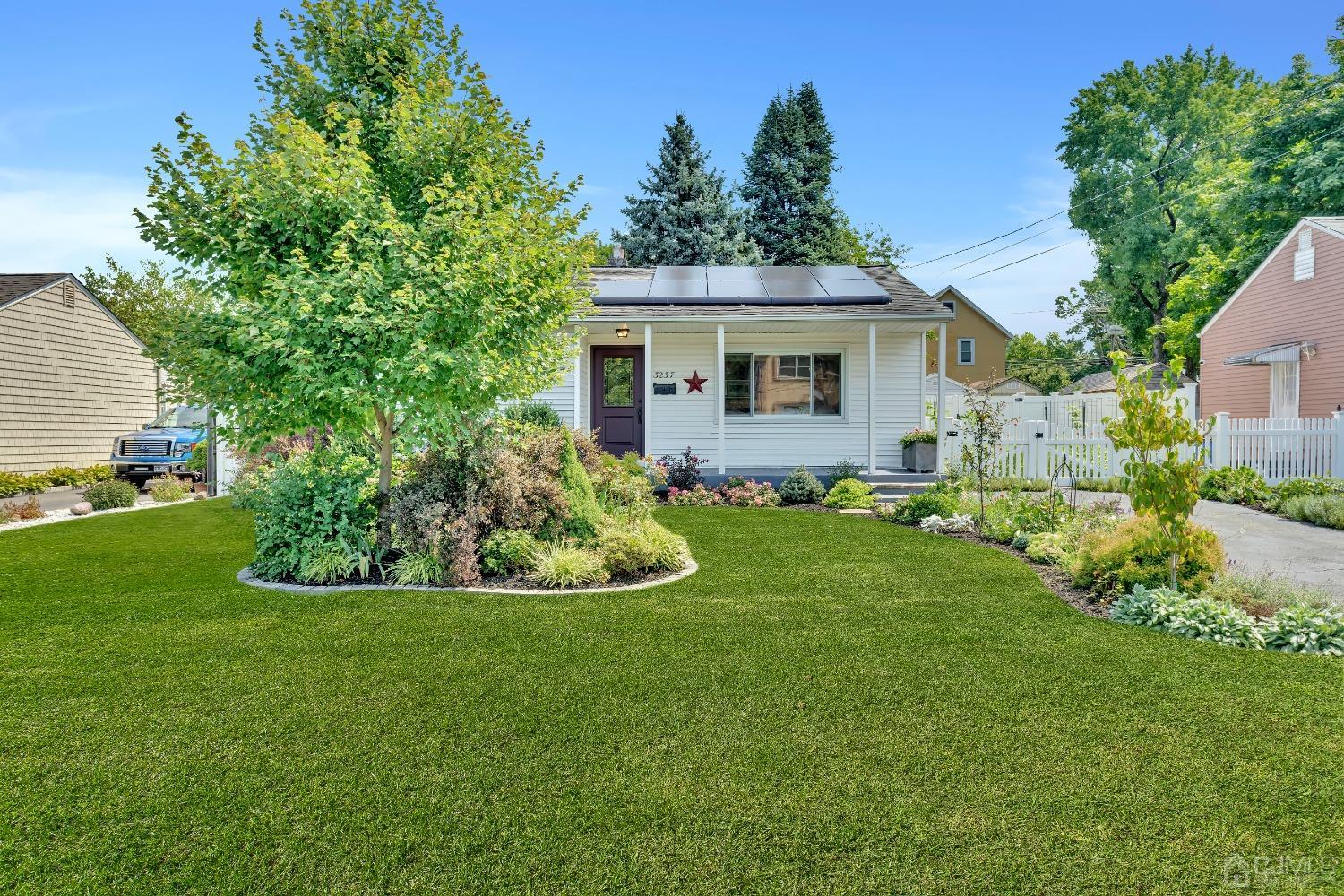 3237 Banta Road South Plainfield, NJ 07080 - Photo 3 of 26 a front view of a house with a garden