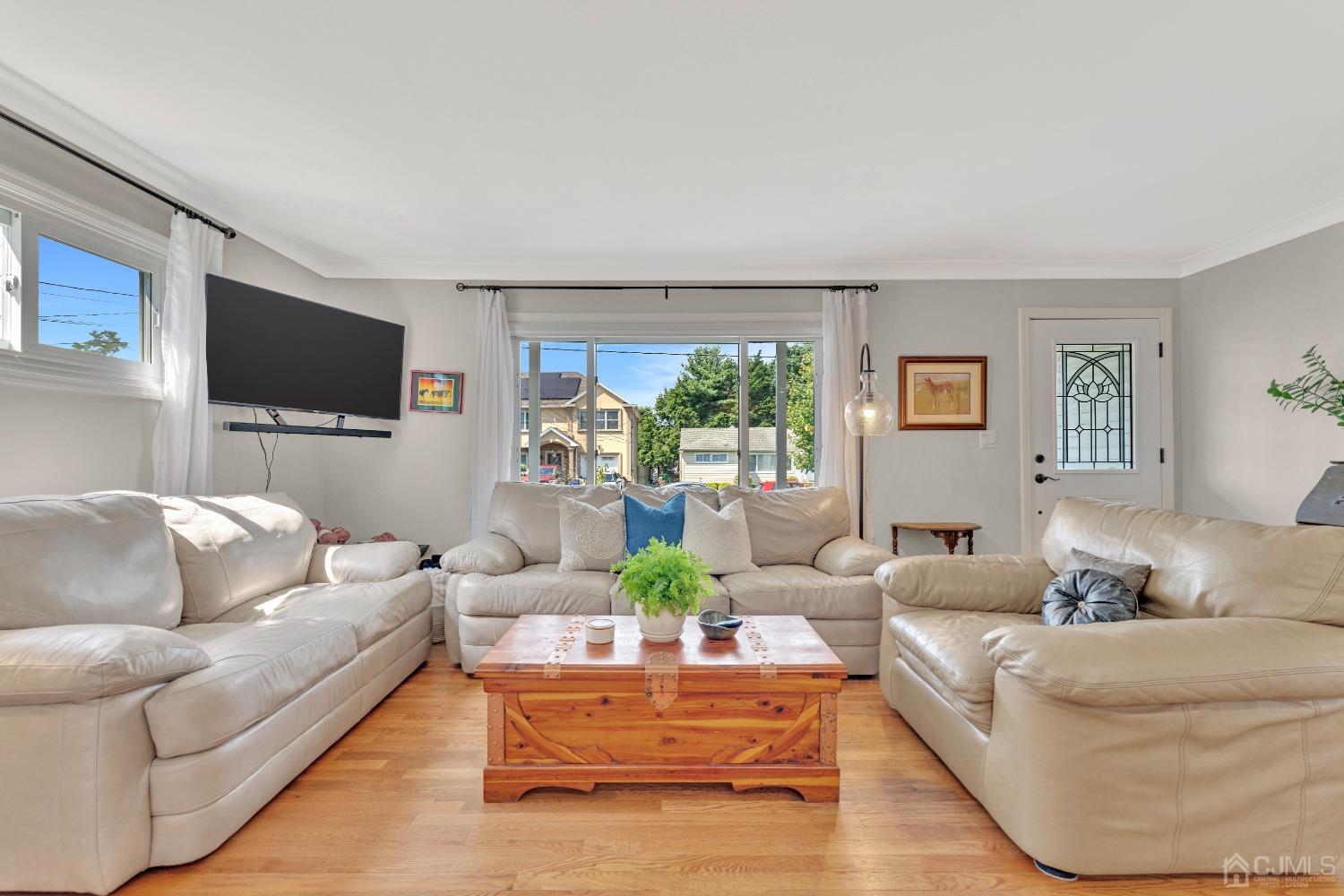 3237 Banta Road South Plainfield, NJ 07080 - Photo 6 of 26 a living room with furniture and a flat screen tv