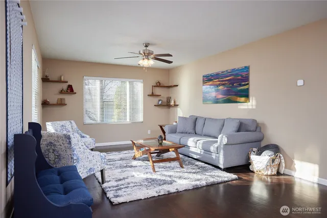 a living room with furniture and a large window