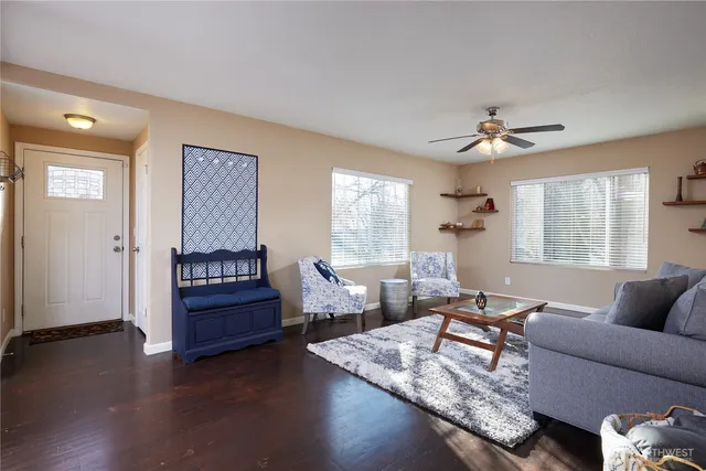 a living room with furniture and a window