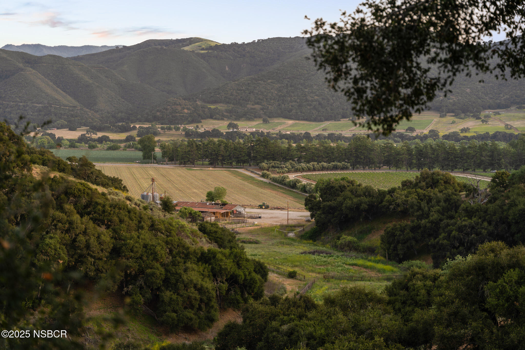 a view of a town with mountains in the background