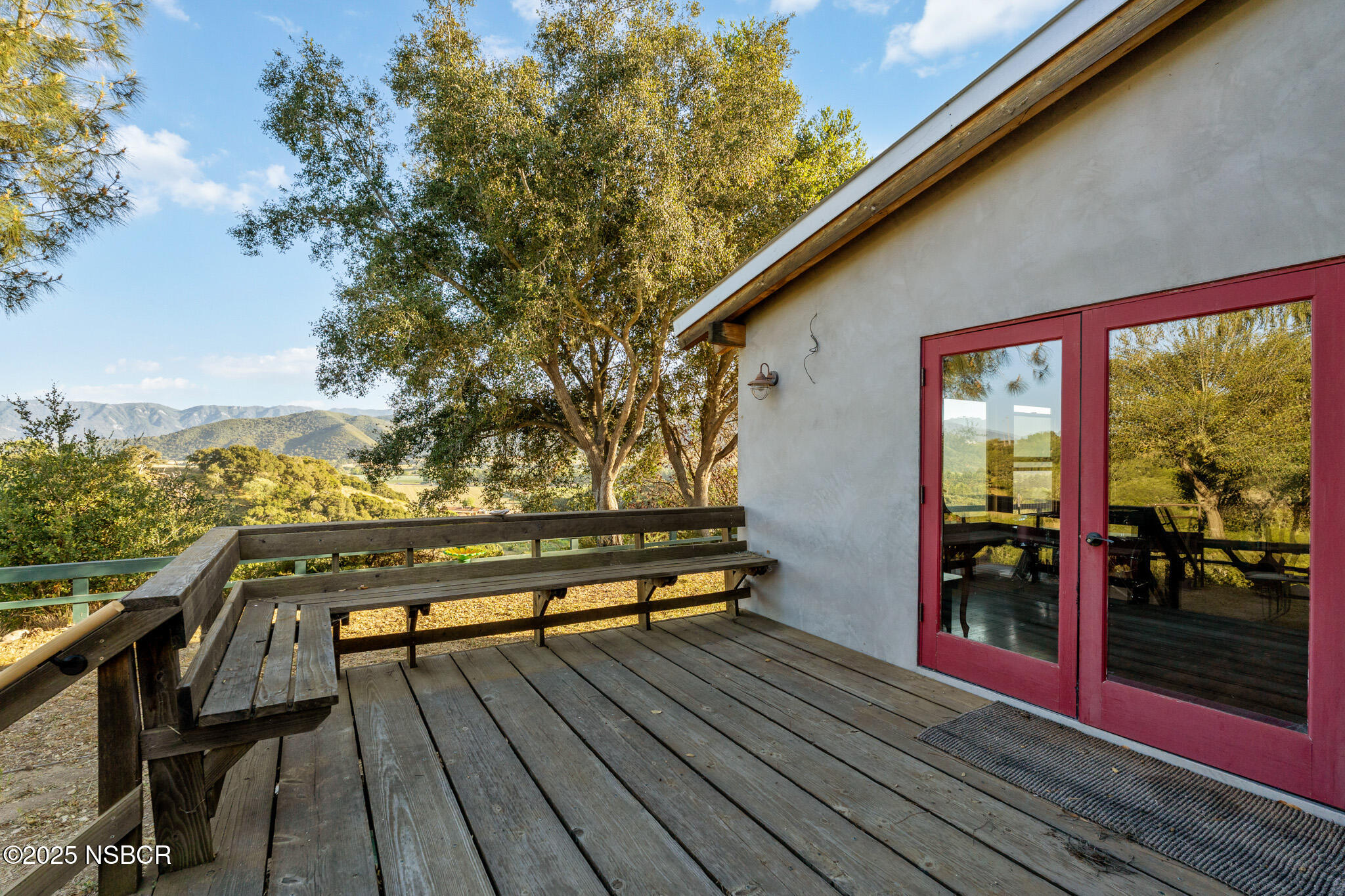 954 Ballard Canyon Road Solvang, CA 93463 - Photo 15 of 17 a view of a wooden deck with a bench