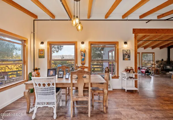 a view of a dining room with furniture window and outside view