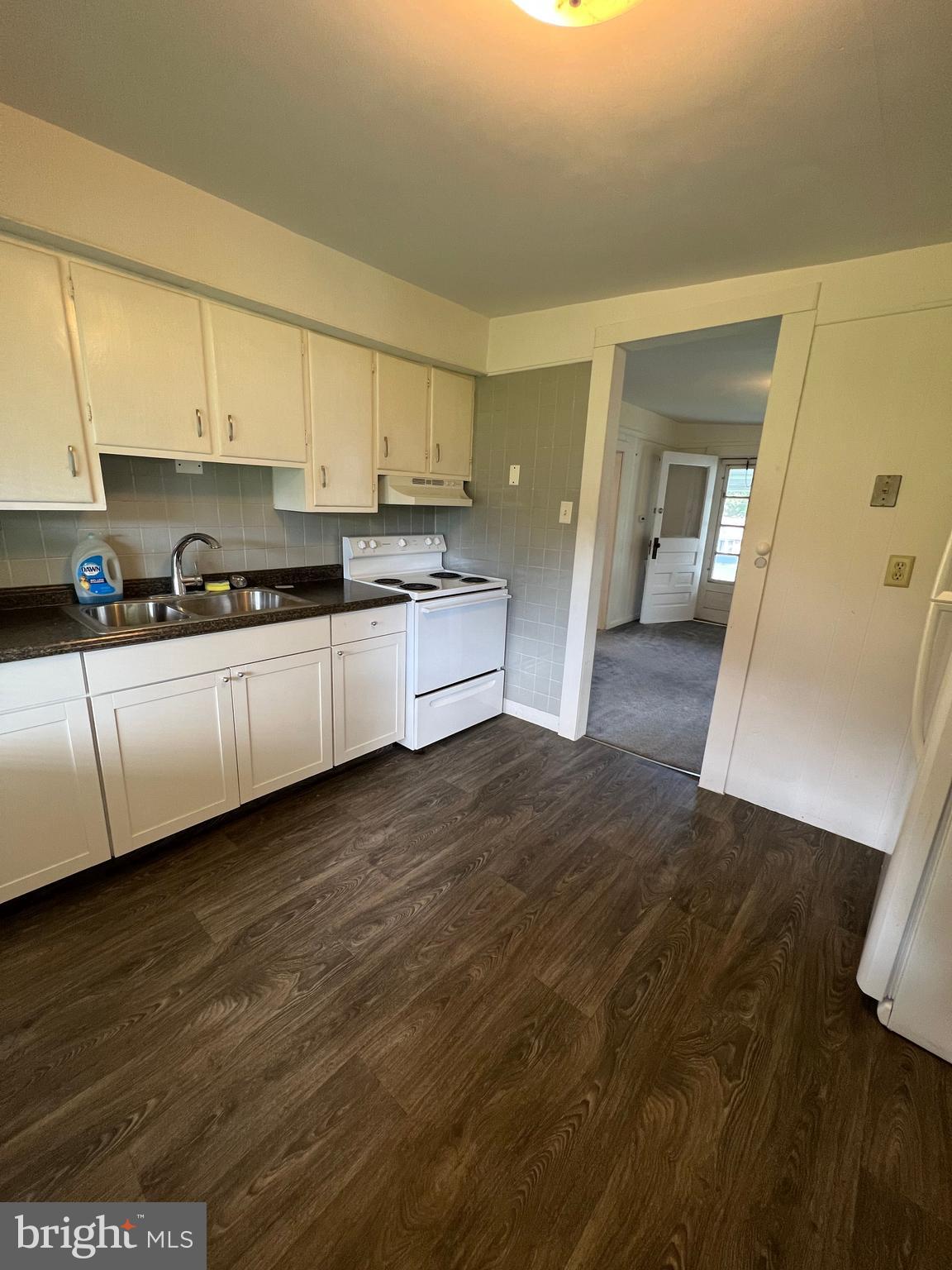 2136 Church Road York, PA 17408 - Photo 2 of 5 a kitchen with stainless steel appliances granite countertop a sink and cabinets