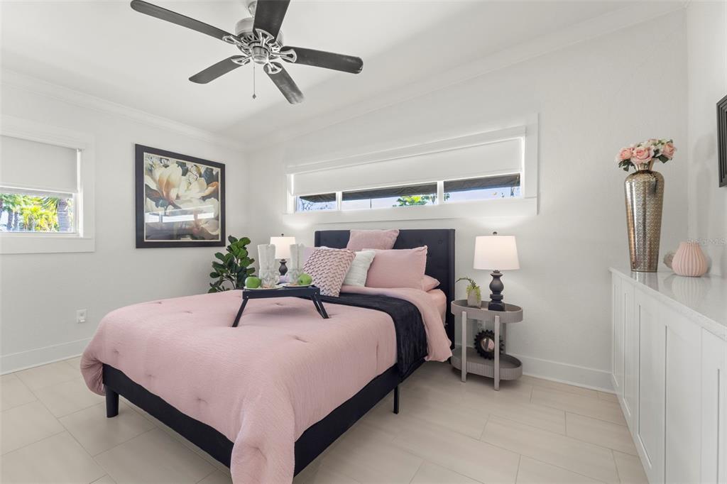 402 161st Avenue Redington Beach, FL 33708 - Photo 11 of 55 a bedroom with a bed and ceiling fan