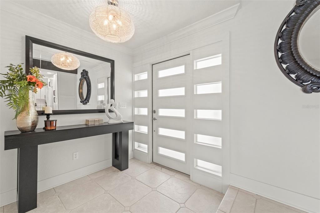 402 161st Avenue Redington Beach, FL 33708 - Photo 2 of 55 a bathroom with a double vanity sink and a mirror