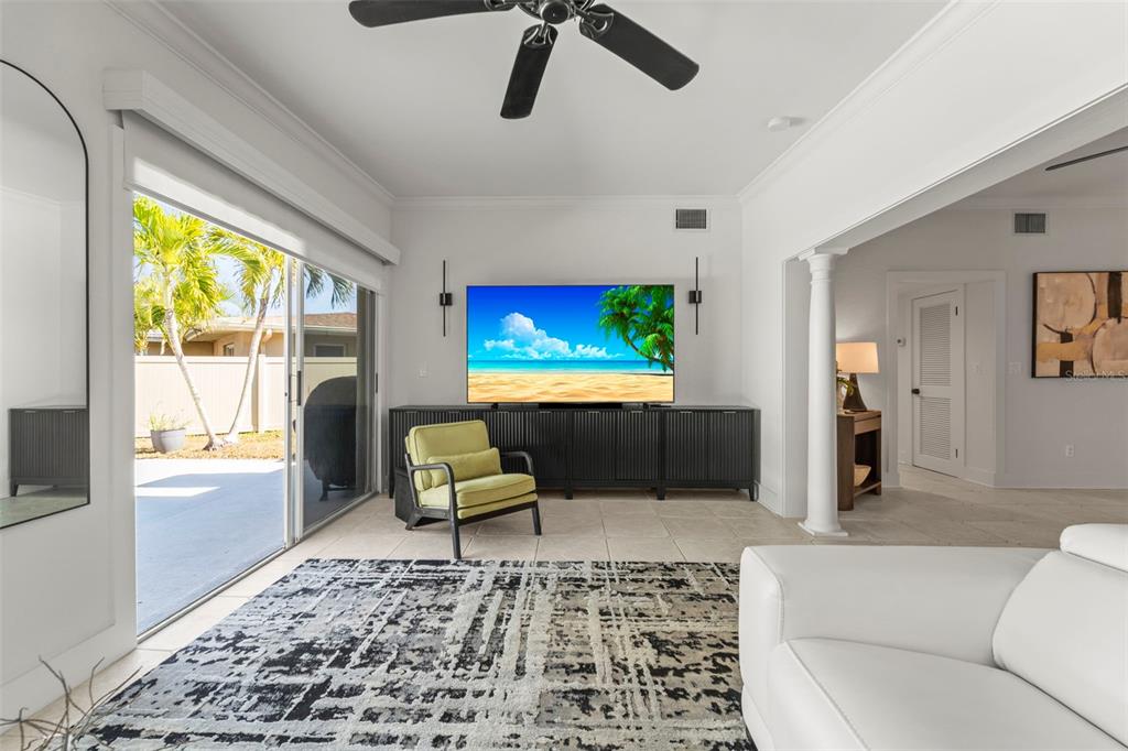 402 161st Avenue Redington Beach, FL 33708 - Photo 25 of 56 a living room with furniture and a flat screen tv