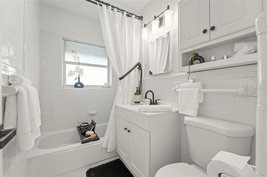 402 161st Avenue Redington Beach, FL 33708 - Photo 40 of 56 a bathroom with a sink toilet and shower