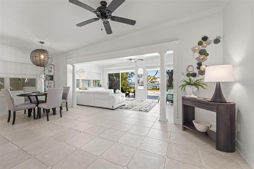 402 161st Avenue Redington Beach, FL 33708 - Photo 7 of 55 a living room with furniture and a chandelier