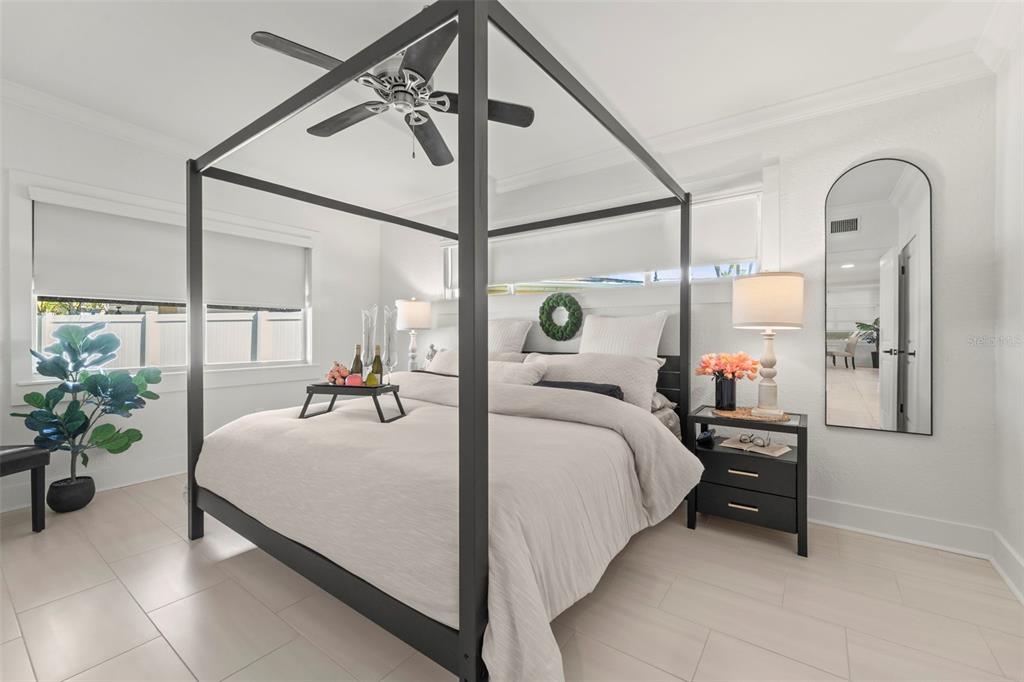 402 161st Avenue Redington Beach, FL 33708 - Photo 9 of 55 a bedroom with bed and balcony